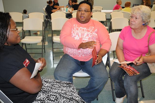 Susan Triplett, left, and Gordon Thomas, both of Hodgenville, talk with Monica Bamwine, coordinator for graduate and academic outreach programs at CU, about the possibility of obtaining master's degrees at the local site. (Campbellsville University Photo by Ashley Zsedenyi)