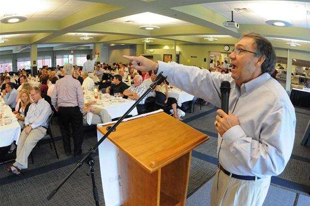 Darrell Kemp, one of several auctioneers helping the university, acknowledges a bid during the Annual CU Booster Dinner and Auction. (CU Photo by Richard RoBards)