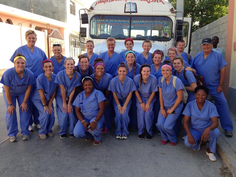 Campbellsville University’s School of Nursing made its fifth trip to Haiti in July. From left are: Front row -- Vennita (Haitian nurse), Emily Reddington (physical therapy assistant, Ohio), Hillary Hutchinson (CU nursing student, Columbia, Ky.), Chelsea Jeffries (CU nurse graduate, Elizabethtown, Ky.), Michele Snipp (Western Kentucky University social work student, Taylorsville, Ky.), Ester (Haitian translator), Hannah White (CU nurse graduate, Elizabethtown, Ky.), Susan Reddrick (RN at Hardin Memorial Hospital, Bardstown, Ky.), and Rachel Smith (CU nursing student, Louisville, Ky.) Middle row -- Laura Thomas (CU nurse graduate, Cecilia, Ky.), Kayci Fisher (CU nursing student, Westmoreland, Tenn.), Tawana Eastridge (KORT Physical therapy assistant, Campbellsville, Ky.), Kari Greene (nursing student, Louisville, Ky.), Julie Smith (CU nursing student, Horseheads, N.Y.), Mandi Thompson (UPS Supervisor, Greensburg, Ky.), Angie Atwood (CU assistant professor of nursing, Greensburg, Ky.) Back row -- Freddy Scruggs (retired, Westmoreland, Tenn.), Kevin Atwood (Ingersoll Rand assembler, Greensburg, Ky.), Mason Atwood (Green County Middle School student, Greensburg, Ky.), Olivia Parrott (CU nursing student, Greensburg, Ky.), Mary Chris Denison (CU nurse graduate, Horse Cave, Ky.), and Melony Sharpe (KORT patient service specialist, Greensburg, Ky.)