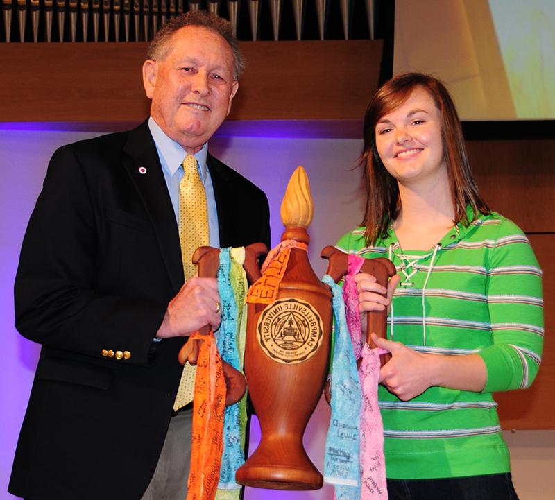 Dr. Frank Cheatham, right, presents Meika  Hamblin of Henderson, Ky. the first Dr. Franklin D  Cheatham Lamp of Learning Award. 